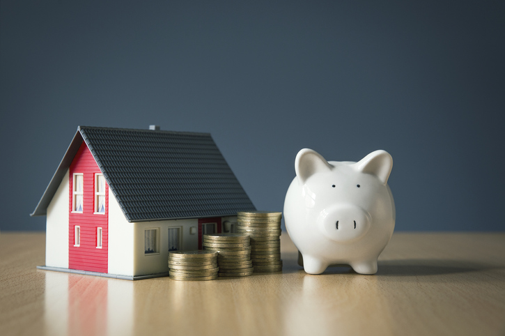 A house, coins, and a piggy bank